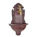 A CAST IRON WALL FOUNTAIN