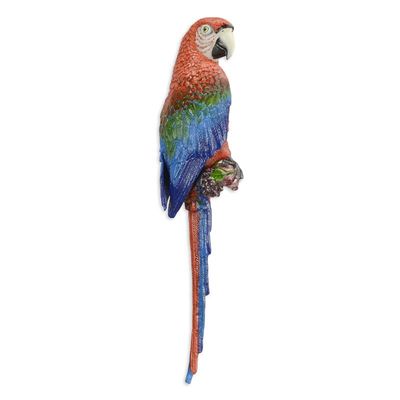 A CAST IRON WALL MOUNT RED AND BLUE MACAW