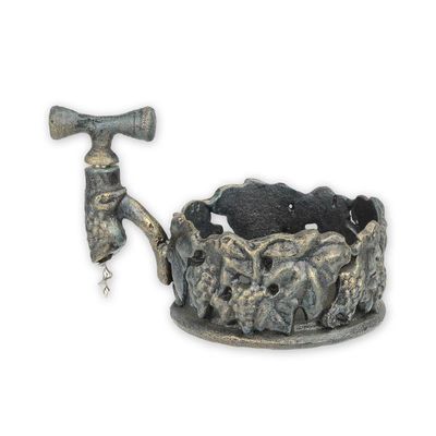 A CAST IRON WINE BOTTLE HOLDER WITH CORKSCREW