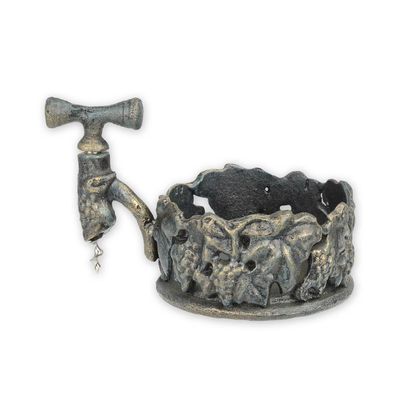 A CAST IRON WINE BOTTLE HOLDER WITH CORKSCREW