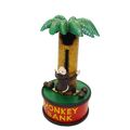 A CAST MONKEY UP A TREE MECHANICAL BANK AND MUSIC BOX