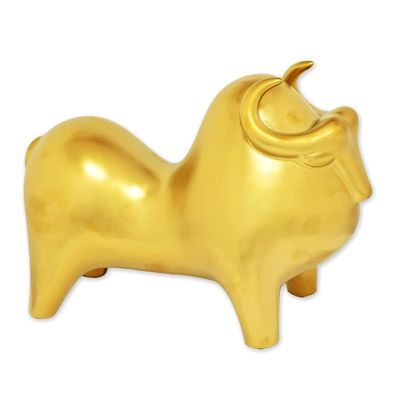 A CERAMIC FIGURINE OF A BUFALO