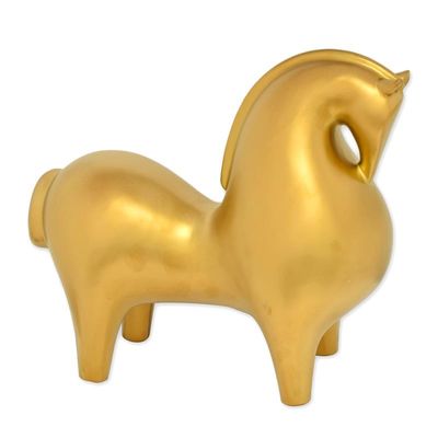 A CERAMIC FIGURINE OF A HORSE