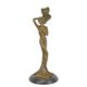 A FIGURAL BRONZE CANDLESTICK