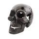 A GREY CAST IRON SKULL