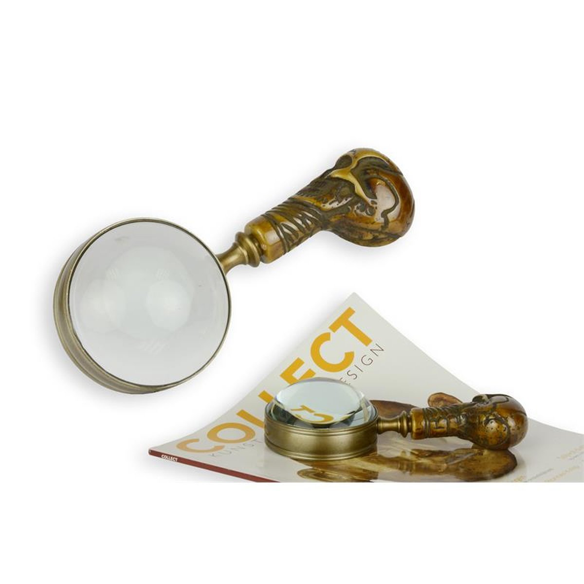 A HAND-LENS WITH SKULL HANDLE