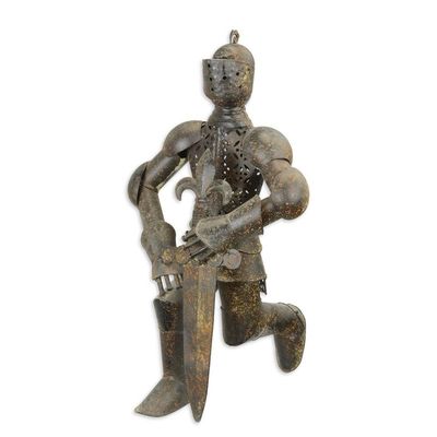 A KNEELING IRON KNIGHT