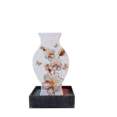 A MARBLE FOUNTAIN ON A  BLACK BASE