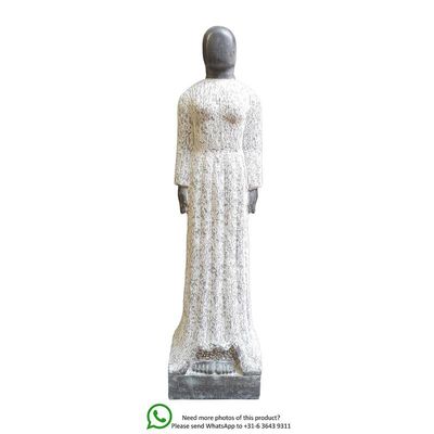 A MARBLE SCULPTURE OF A FEMALE IN WHITE GOWN
