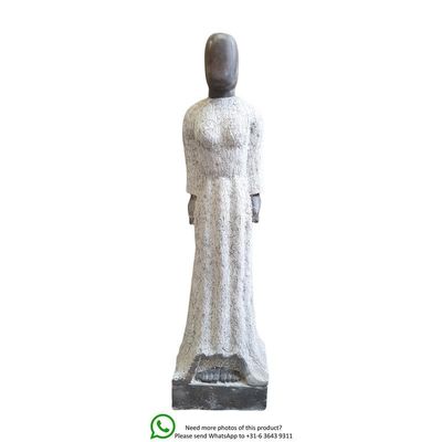 A MARBLE SCULPTURE OF A FEMALE IN WHITE GOWN