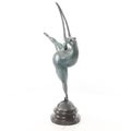 A MODERNIST BRONZE SCULPTURE OF A NUDE FEMALE DANCER