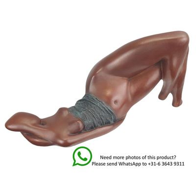 A MODERNIST BRONZE SCULPTURE OF A RECLINING FEMALE NUDE