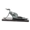 A MODERNIST BRONZE SCULPTURE OF A RECUMBENT FEMALE NUDE