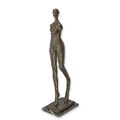 A MODERNIST BRONZE SCULPTURE OF A WALKING FEMALE NUDE