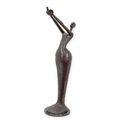 A MODERNIST BRONZE SCULPTURE OF A WOMAN HOLDIGN A BIRD