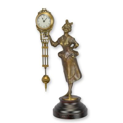 A MYSTERIEUSE TABLE CLOCK SHAPED AS A WOMAN
