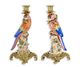 A PAIR OF BRONZE MOUNTED PORCELAIN PARROT CANDLE HOLDERS