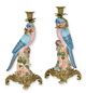 A PAIR OF BRONZE MOUNTED PORCELAIN PARROT CANDLE HOLDERS