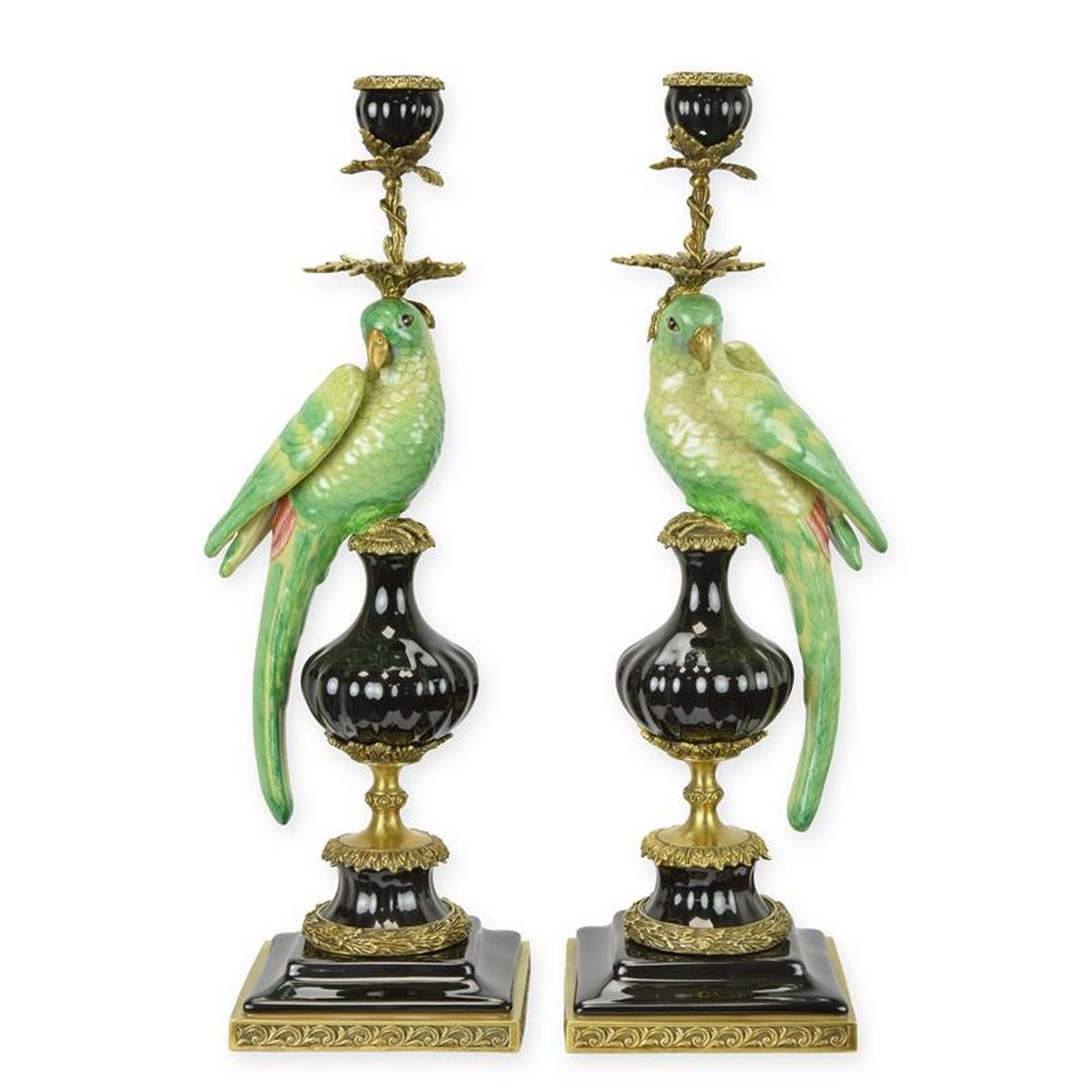 A PAIR OF BRONZE MOUNTED PORCELAIN PARROT CANDLE HOLDERS