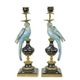 A PAIR OF BRONZE MOUNTED PORCELAIN PARROT CANDLE HOLDERS