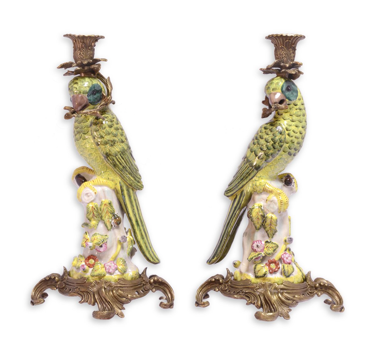 A PAIR OF BRONZE MOUNTED PORCELAIN PARROT CANDLE HOLDERS