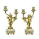 A PAIR OF BRONZE MOUNTED TWO BRANCH PORCELAIN CANDELABRA