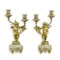 A PAIR OF BRONZE MOUNTED TWO BRANCH PORCELAIN CANDELABRA