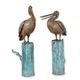 A PAIR OF BRONZE PELICANS ON POST FOUNTAINS