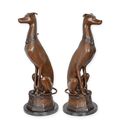 A PAIR OF BRONZE SITTING WHIPPETS