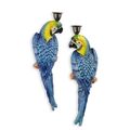 A PAIR OF CAST IRON BLUE AND YELLOW MACAW CANDLEHOLDERS