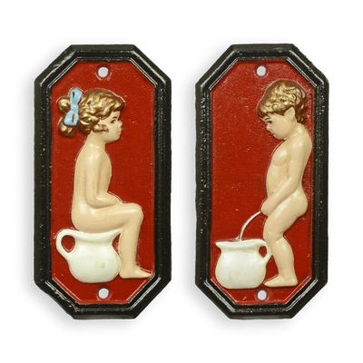 A PAIR OF CAST IRON BOY AND GIRL TOILET PLAQUES - RED