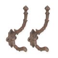 A PAIR OF CAST IRON BROWN COAT HOOKS