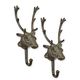 A PAIR OF CAST IRON DEER HEAD COAT-HOOKS