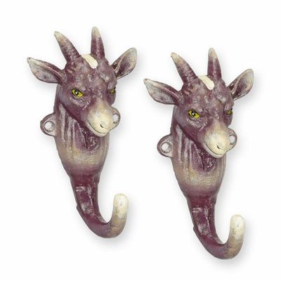 A PAIR OF CAST IRON GOAT COAT HOOKS