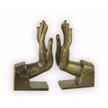 A PAIR OF CAST IRON HAND SHAPED BOOKENDS