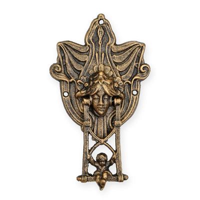 A PAIR OF CAST IRON PUTTO ON SWING DOORKNOCKERS