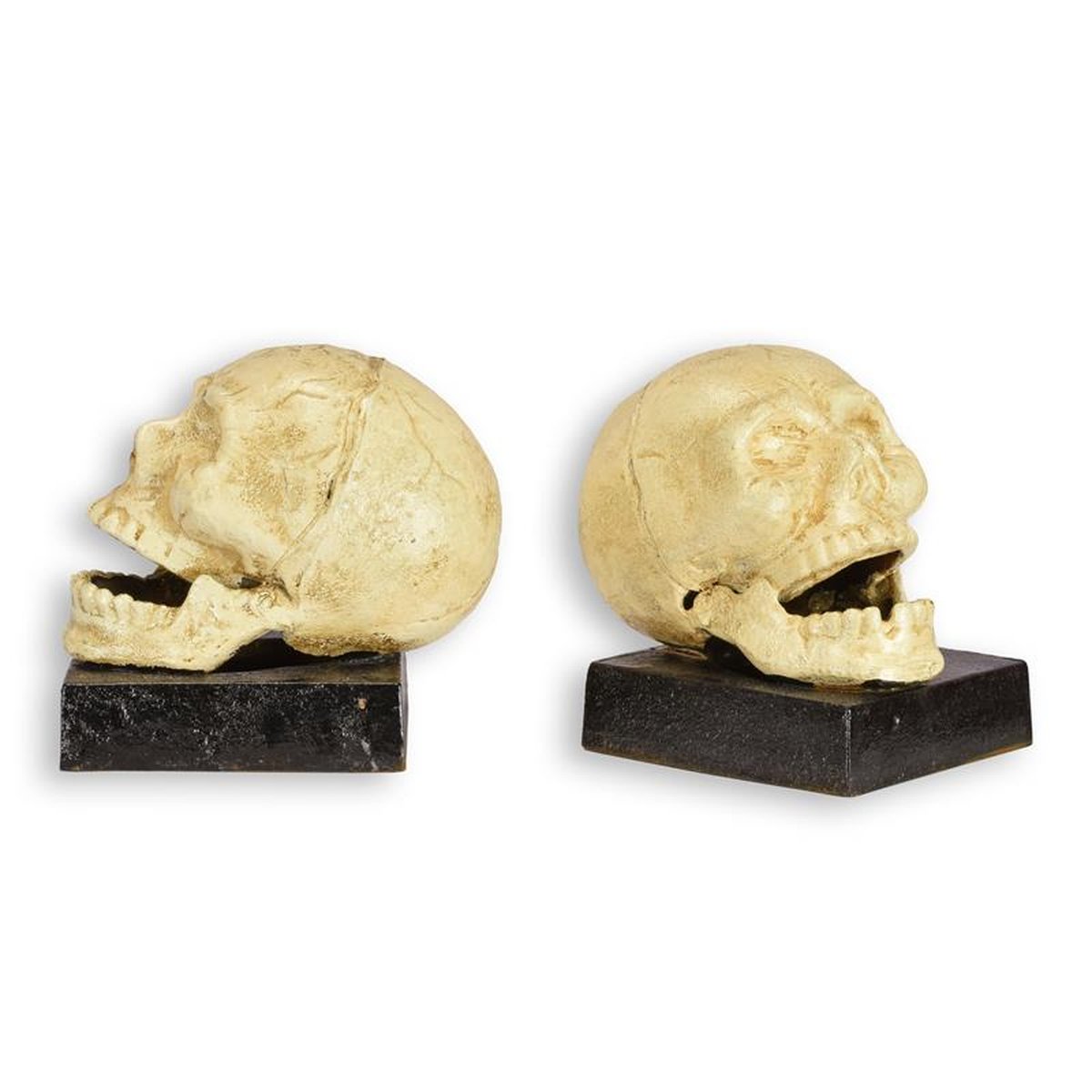 A PAIR OF CAST IRON SKULL BOOKENDS