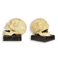 A PAIR OF CAST IRON SKULL BOOKENDS