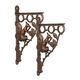A PAIR OF CAST IRON WALL BRACKETS