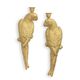 A PAIR OF CAST IRON WALL MOUNT GOLD MACAW CANDLEHOLDERS