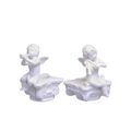A PAIR OF FIGURAL CANDLE HOLDERS