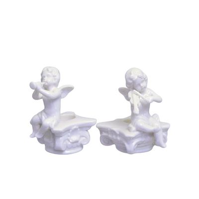 A PAIR OF FIGURAL CANDLE HOLDERS