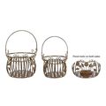 A PAIR OF IRON BASKETS - BROWN