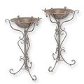 A PAIR OF IRON BIRD BATHS