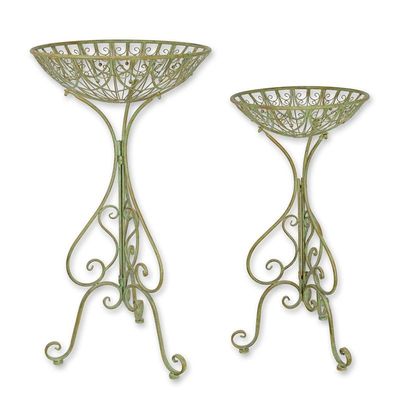 A PAIR OF IRON FLOWER BOWLS ON STAND