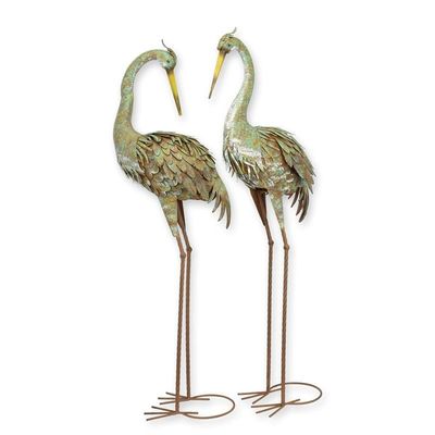 A PAIR OF IRON HERONS