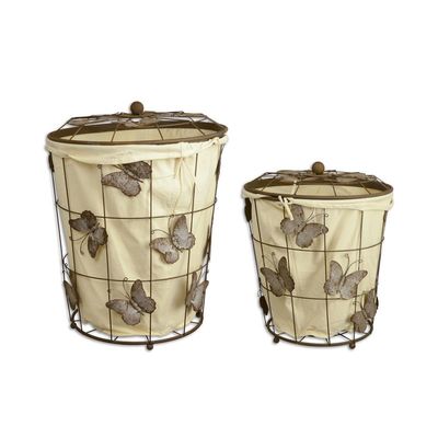 A PAIR OF IRON LAUNDRY BASKETS