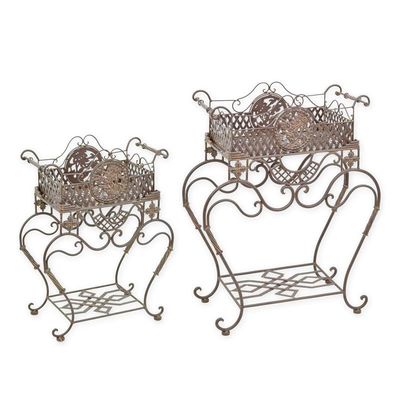 A PAIR OF IRON PLANTERS ON STAND - BROWN
