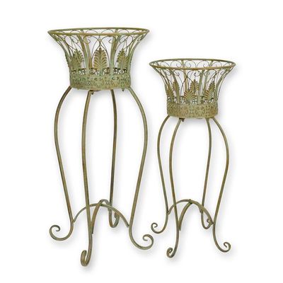 A PAIR OF IRON PLANTERS ON STAND
