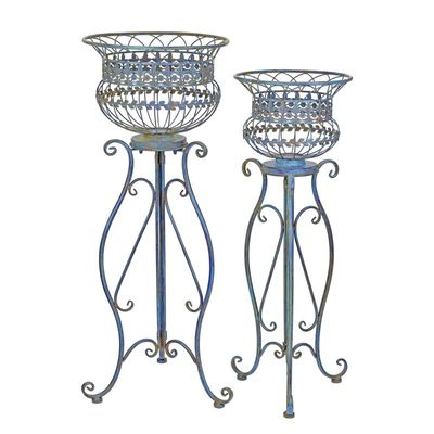 A PAIR OF IRON PLANTERS ON STAND